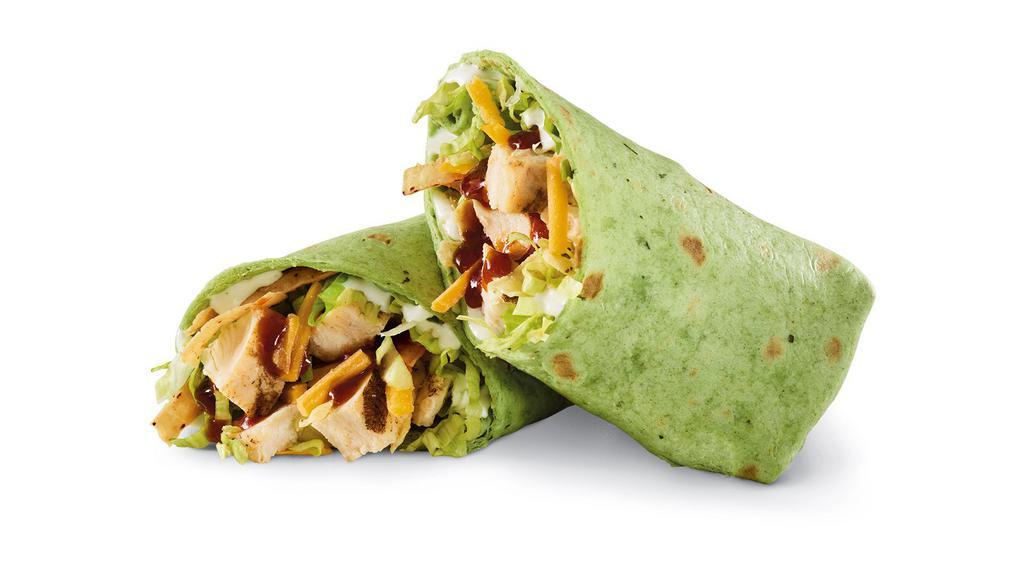 Whiskey River® Bbq Chicken Wrap · Sliced chicken breast, Whiskey River® BBQ sauce, cheddar, lettuce, tortilla strips, and ranch in a spinach tortilla. 1020 cal.