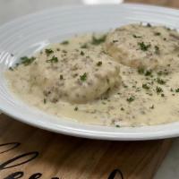Biscuits & Gravy · Country sausage gravy with two eggs.