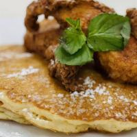 Chicken & Pancakes · Pancakes, breaded and fried chicken breast, topped with pure maple syrup.
