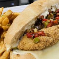 Fish Philly · Fried cape hake fillet, grilled onions, bell peppers, tartar sauce, pickles, and provolone o...