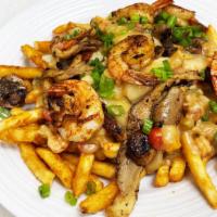 Rebel Fries · Fries with seafood etouffe, pepper jack cheese, topped with jumbo shrimp, crawfish, pepper j...