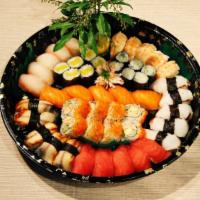 Nigiri & Maki Combo · 5 pieces of tuna, salmon, red napper, shrimp octopus and eel nigiri sashimis. California rol...