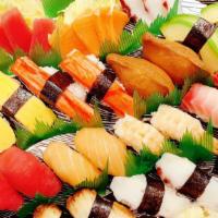 Nigiri & Sashimi Combo · 2 pieces of crab, tamogo, avocado, irari, shrimp, tuna, salmon, izumidai, red snapper and oc...