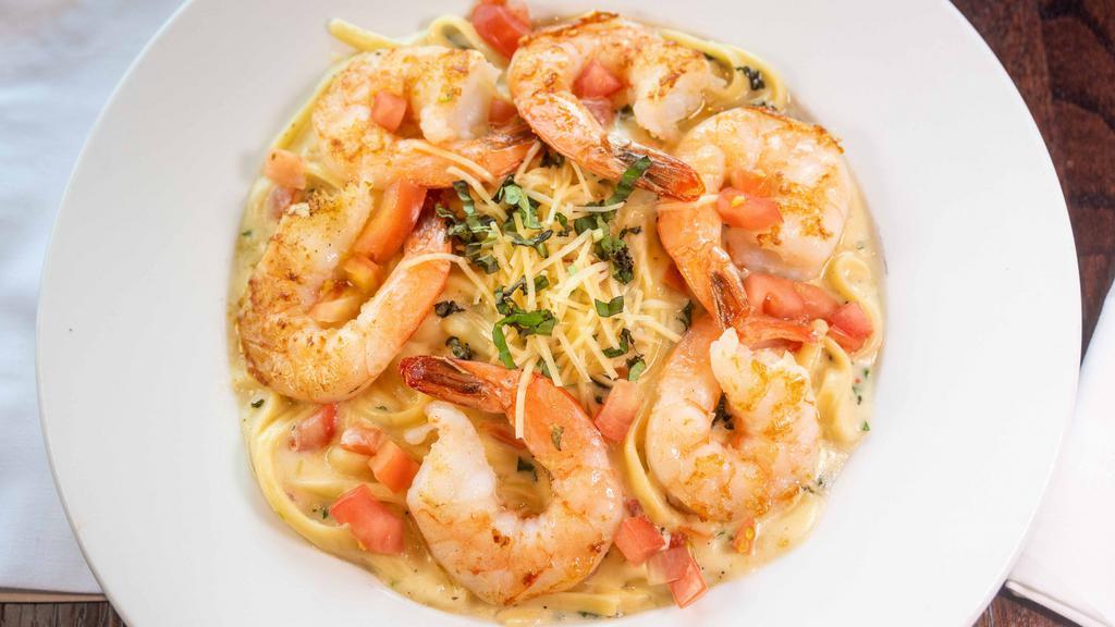 Shrimp Scampi · Jumbo shrimp, sautéed in white wine, fresh basil, garlic cream butter sauce, with tomatoes. Served with linguine noodles.