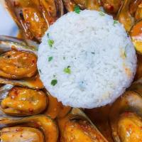 Mussels In House Sauce · 12 large green mussels with a side of cilantro lime rice.