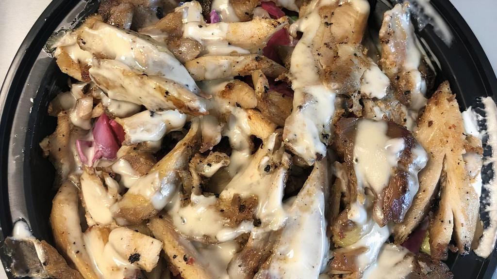 Chicken Shawarma Bowl · Regular Toppings - - - Served with Rice, Lettuce, Tomatoes, Pickles, Garlic, and Tahini. You can customize your toppings below or choose regular.