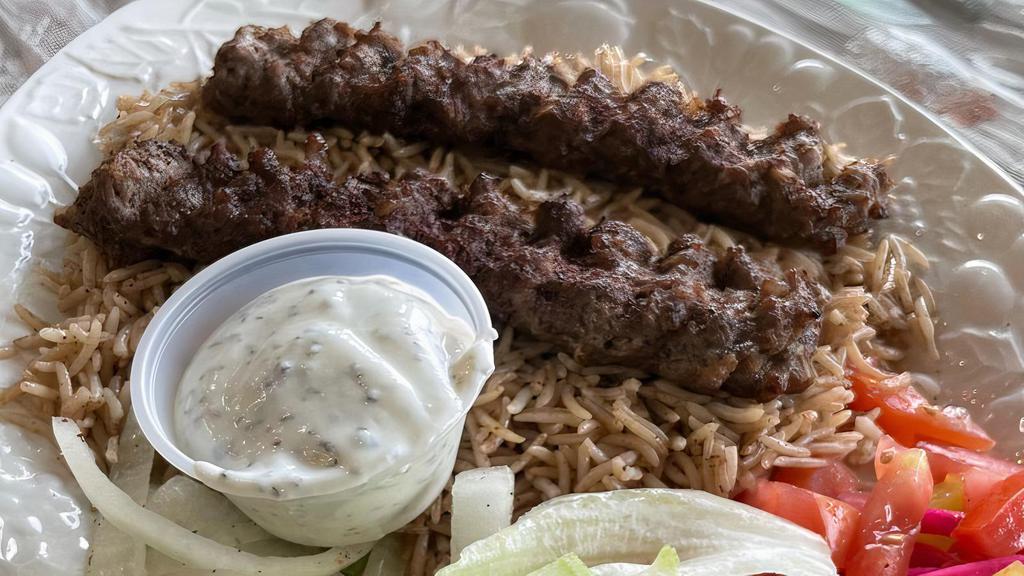 Lamb & Beef Kabob Bowl With Rice · Served with 2 kabob skewers over rice, lettuce, tomato, onions and a piece of bread.