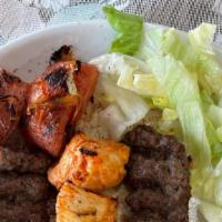 Mix Iraqi Style Kabob · 1 Chicken tikka skewer, 2 kabob skewers, grilled tomato, grilled onions, salad and bread.