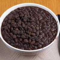 Black Beans · These are not your average beans. They are slow cooked with brisket, onion and secret season...