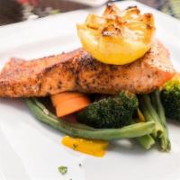Blackened Salmon Filet · Grilled salmon filet with a light coating of blackened redfish seasoning. Served with our st...