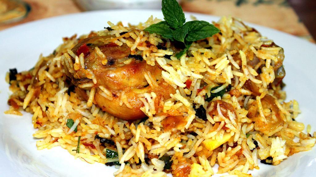 Chennai Veg Biriyani · Spicy flavored rice cooked with fresh veg and special southern spices. Served with raitha and salna.