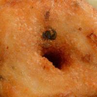Vadai · Lentil doughnuts deep-fried. Served with assorted chutneys and sambar.