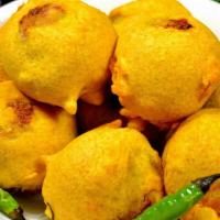Aloo Bonda · Batter fried potato dumpling served with hot chutney.