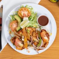Pollo A La Plancha · Grilled Chicken served with Salad, Avocado, Cheese, Lemon, Rice, Beans & Tortillas