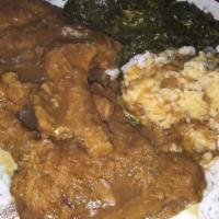 Smothered Pork Chops Dinner (2Pc) · Momma's Place favorite: It comes with two sides and cornbread.