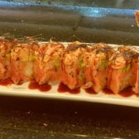 Pink Lady Roll · Shrimp tempura, spicy tuna avocado in soy paper topped with spicy crabmeat, with yuzu unagi ...