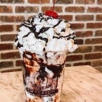 Storm Tropper Sundae · Cookie's and Cream ice cream, Oreo cookie, marshmallow cream ,and chocolate drizzle. Topped ...