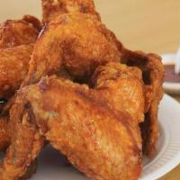 Chicken Wings · Chicken wings deep-fried. Served with celery and dressing.