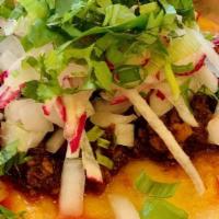 Chorizo Taco · Onions, scallions, cilantro and radishes on corn tortilla.