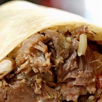Carnitas Burrito · Lettuce, rice, beans, cheese, sour cream, and pico de gallo. Meat is (Pork)