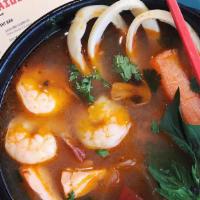 Pohk Thak Soup · Mild spicy. Combination of shrimp, squid, muscles, fish and fresh mushrooms in spicy lemongr...