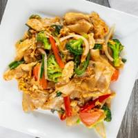 Drunken Noodles · Stir fried wide rice noodles with egg, tomatoes chili peppers green onion, broccoli, red bel...