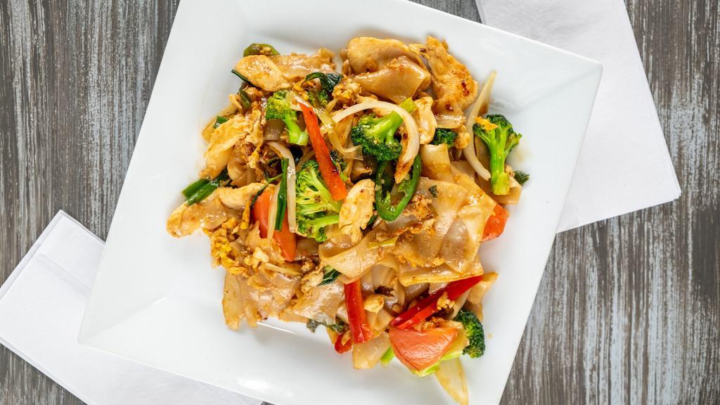 Drunken Noodles · Stir fried wide rice noodles with egg, tomatoes chili peppers green onion, broccoli, red bell peppers and basil. Choice of chicken, tofu or vegetables.
