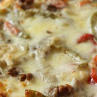 Philly Cheese Steak Pizza · Thinly Sliced Steak, Cheese, Onions & Peppers