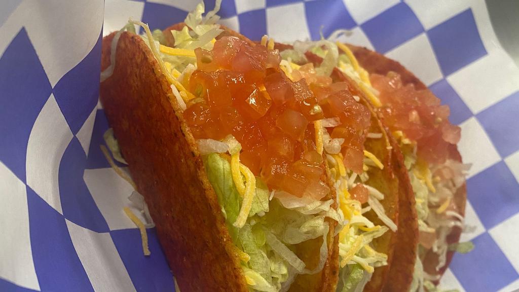 Beef Taco · Topped with onions, lettuce ,tomato ,cheese and sour cream