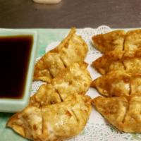 Pot Stickers · Ground pork and chopped veggies in crispy wonton with soy sauce.