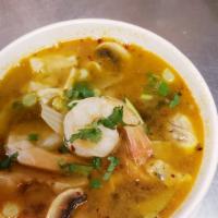 Tom Yum (Large) · Hot and sour soup with galangal, lemongrass, tomatoes, onions, cabbage, mushroom, lime leave...