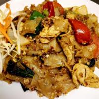 Kee Mao (Drunken Noodles) · Stir fried wide noodles with egg, onions, bell pepper, tomatoes, and chili paste sauce.