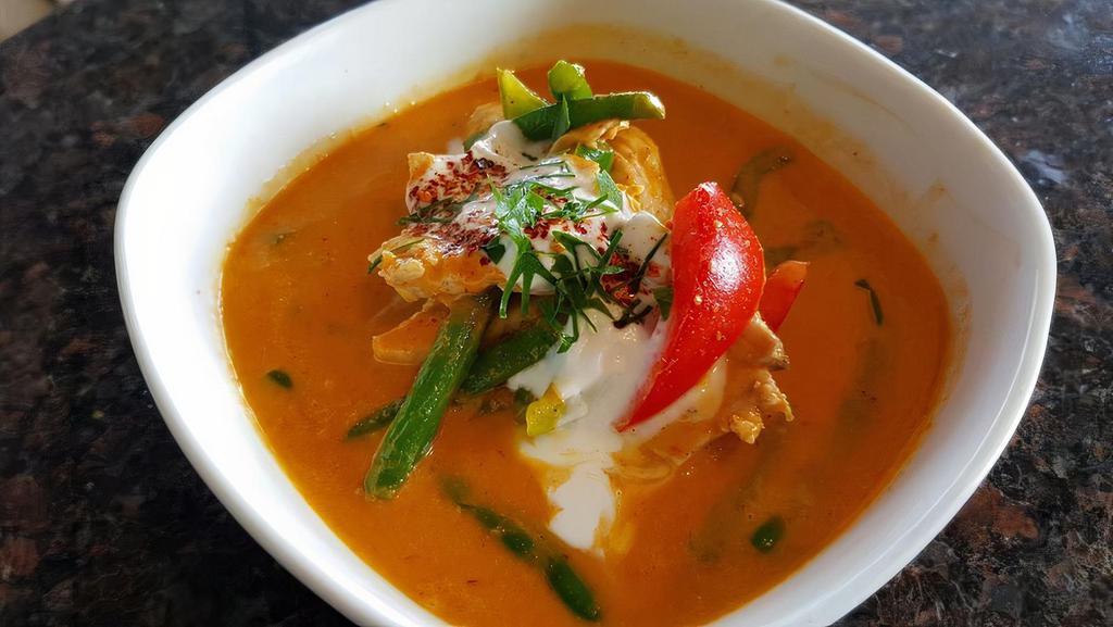 Red Curry · Coconut milk with red curry paste, bamboo shoots, bell peppers, eggplants and fresh basil.