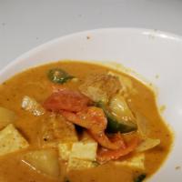Pineapple Curry · Coconut milk with red curry paste, onion, bell peppers, tomatoes and fresh basil.