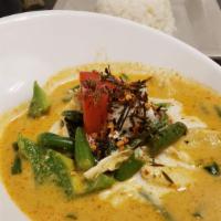 Panang Curry · Coconut milk with panang curry paste, bell peppers, green beans, basil and kaffir lime leaves.