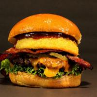 Smu Burger · 1/3 Lb. Patty, Leaf Lettuce, Pickles, Bacon, Onion Ring, Cheddar Cheese, BBQ Sauce.