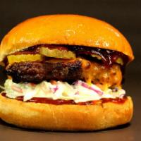 Dallas Burger · 1/3 Lb. Patty, Cole Slaw, Pickles, Cheddar Cheese, BBQ Sauce.