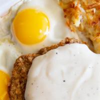 Country Fried Steak And Eggs · Our famous country fried steak topped with country gravy served with two eggs any style, has...