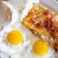 Combo Breakfast · Our homemade biscuit topped with sausage gravy served with two eggs any style, hash browns a...