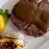 Meatloaf · Thick slices of oven roasted country style meatloaf topped with our homemade brown gravy.