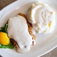 Pork Cutlet · A port tenderloin lightly breaded, deep fried and topped with our delicious country gravy.