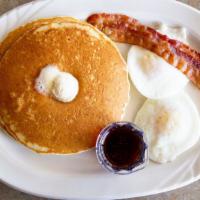 Hot Cake Combo · Two pancakes, two eggs and your choice of two strips of bacon, two sausage links or one saus...