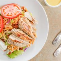 Grilled Chicken Salad · Our marinated grilled chicken breast, with a hard boiled egg, shredded jack and cheddar chee...