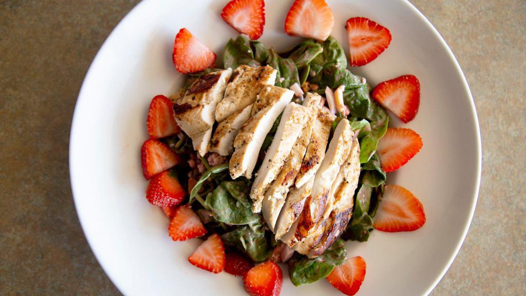 Spinach Salad · A pile of fresh spinach, tomato, egg, bacon, topped with bleu cheese crumbles and fresh strawberries. Served with raspberry vinaigrette or dressing of choice.