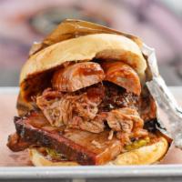 The Playboy Sandwich · Quarter-pound of brisket, and a quarter-pound of pulled pork topped with a half-link of jala...