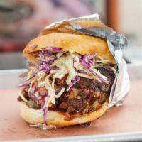 The Silky Sandwich · Slow-cooked pulled pork topped with home made spicy slaw.