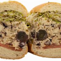 Colby'S Chicken Salad Sandwich · A special blend of spices mixed in with our house shredded chicken, grapes, dried cranberrie...