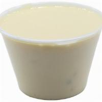 Side Of Our Famous White Cheddar Queso · 