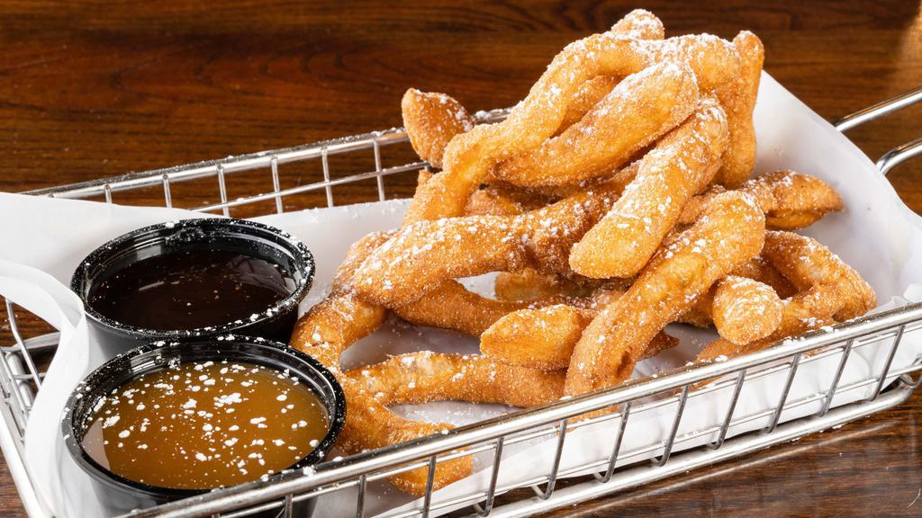 Funnel Cake Fries  · Shareable sized order of funnel cake fries topped with cinnamon sugar and powdered sugar! They come with a caramel and chocolate sauce for dipping!