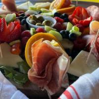 Charcuterie & Cheeses · Prosciutto, salami, soppresata, manchego, grana padano, fruit.